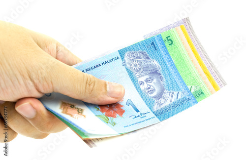 Hand holding Malaysia Ringgit Currency Bank Notes