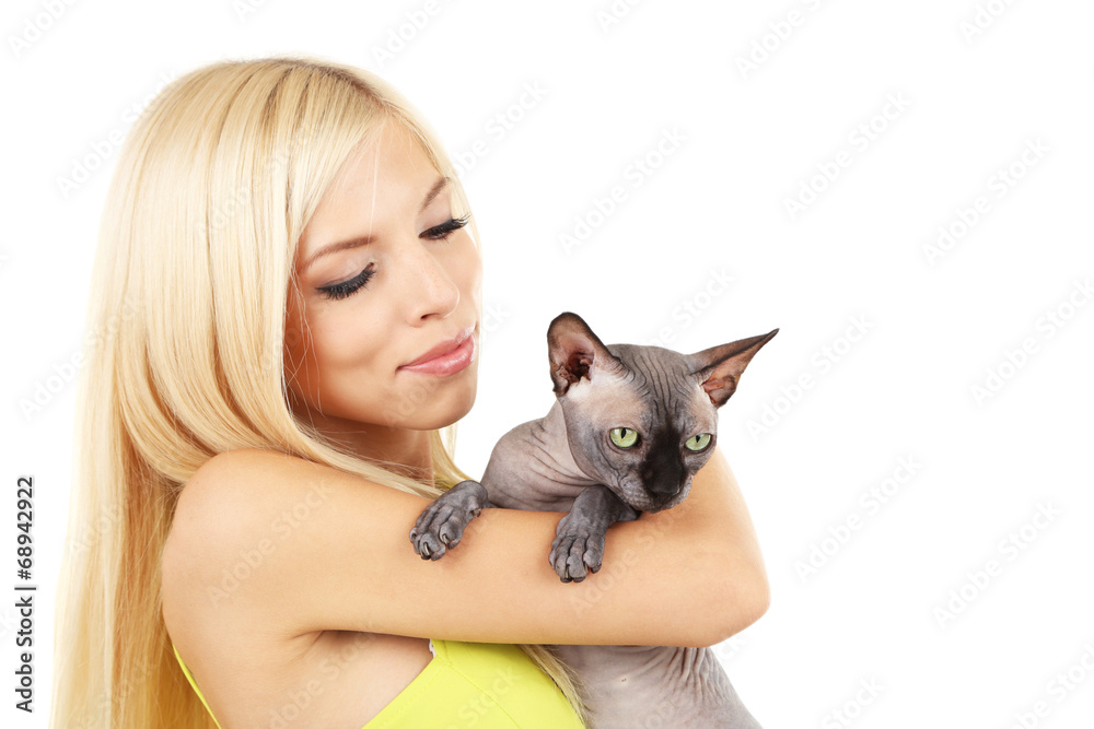Beautiful young woman holding gray sphinx cat isolated on white