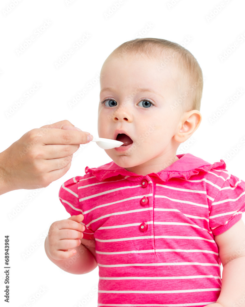 doctor giving remedy feeding with a spoon doctor giving remedy feeding with a spoon