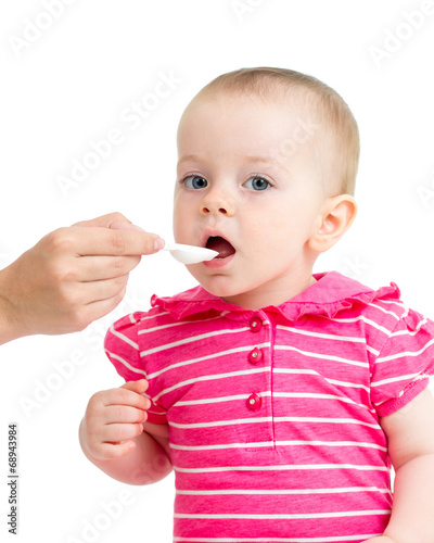 doctor giving remedy feeding with a spoon