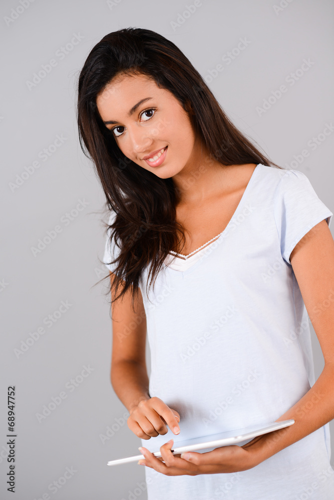 portrait of cheerful young brunette with digital tablet at home portrait of cheerful young brunette with digital tablet at home
