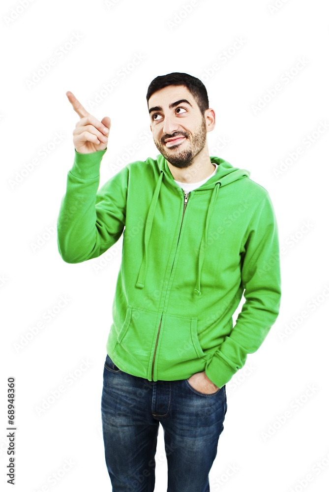 Casual young man pointing and looking upwards, smiling Casual young man pointing and looking upwards, smiling