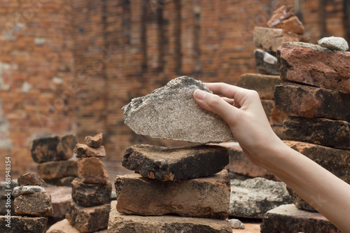 Wallpaper Mural hand with stone heap Torontodigital.ca