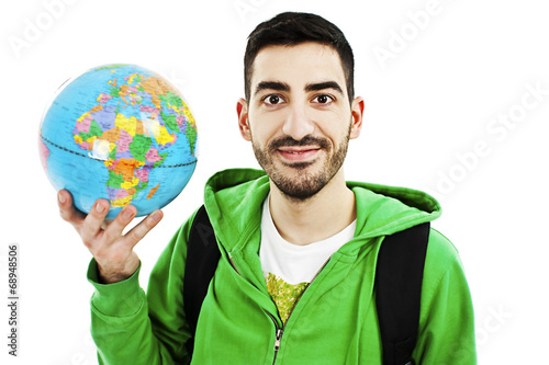 Young traveler with globe on white background photo