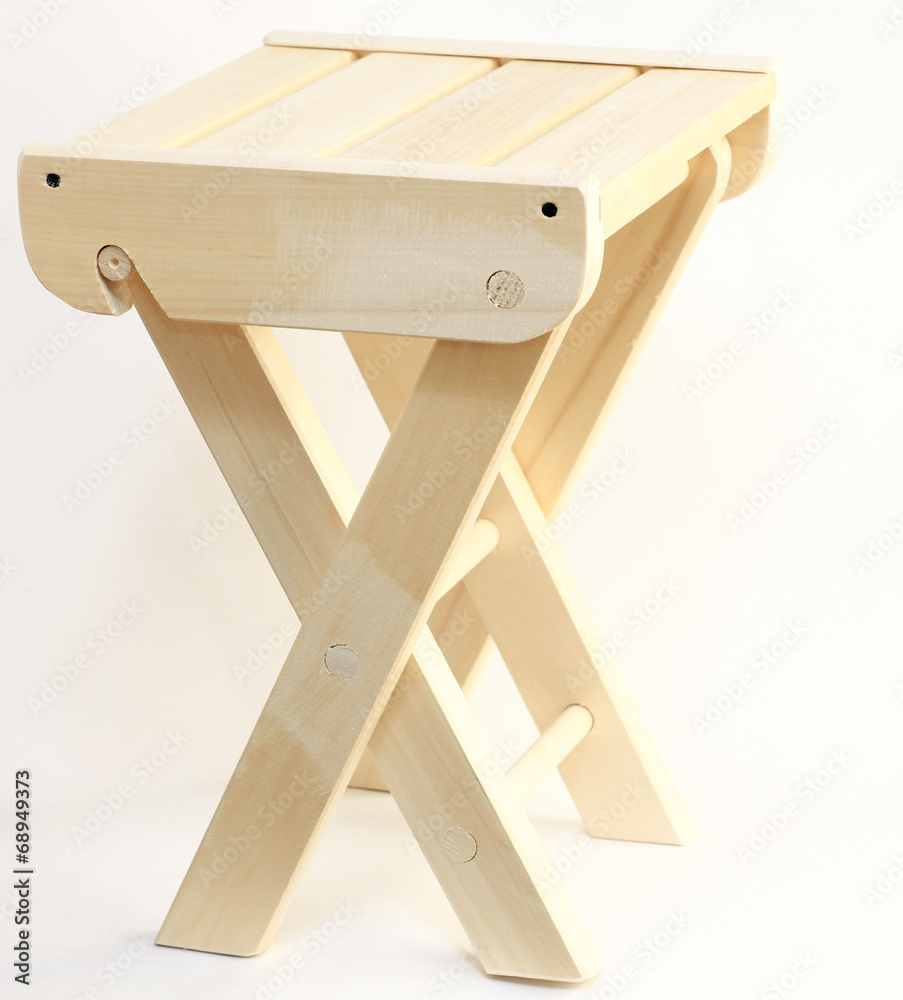 Folding wooden chair on a white background isolated