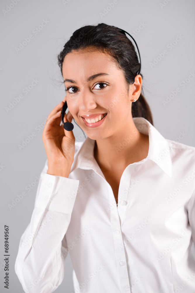 portrait of cheerful young brunette operator customer support portrait of cheerful young brunette operator customer support