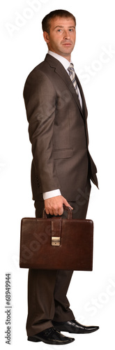 Standing businessman with briefcase