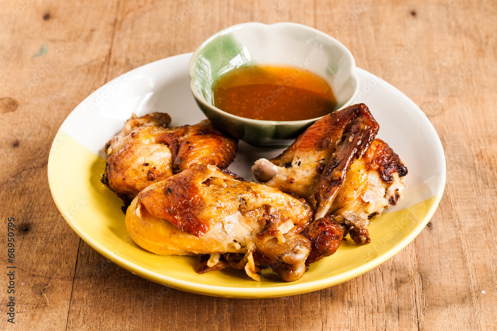 Grilled chicken on dish. Grilled chicken on dish.
