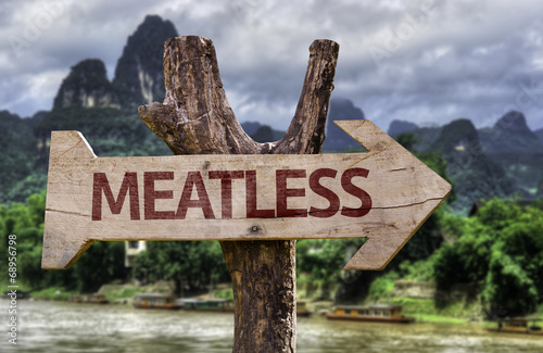 Meatless wooden sign with a forest background photo