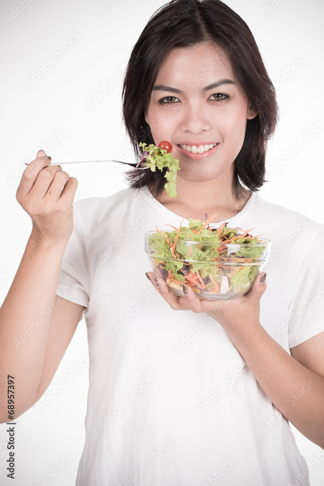 Pretty girl eating fresh vegetable salad Pretty girl eating fresh vegetable salad