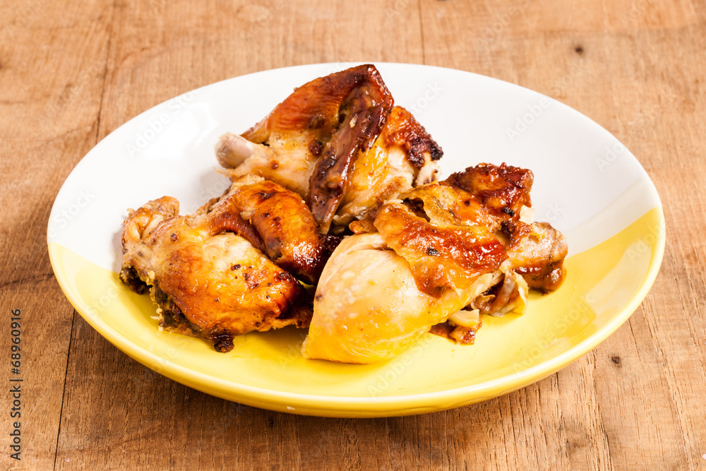 Grilled chicken on dish.