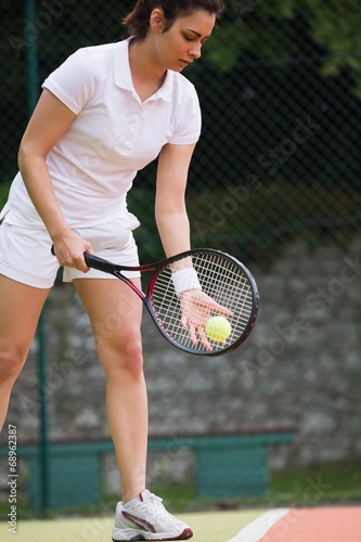 Pretty tennis player ready to serve © WavebreakmediaMicro
