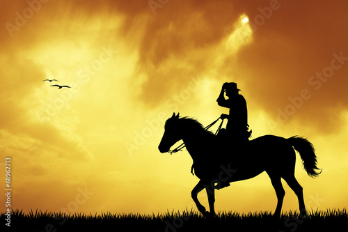cowboys silhouette at sunset