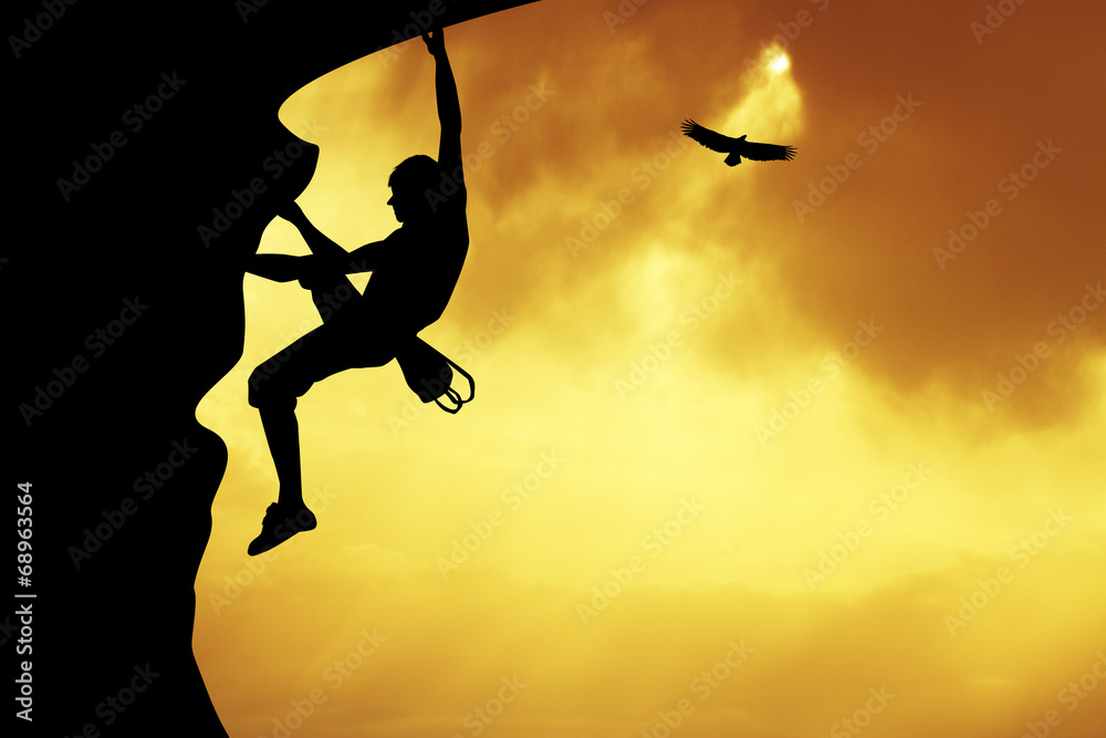 Free climber at sunset