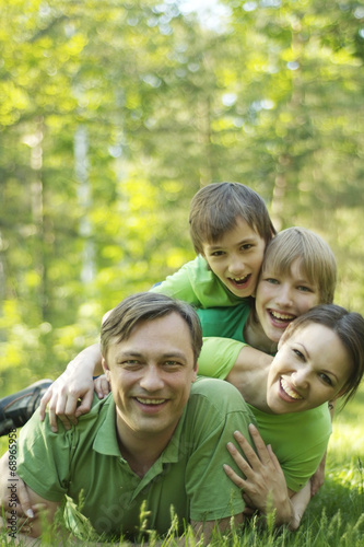 Family resting in summer park