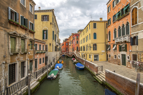Fototapeta Naklejka Na Ścianę i Meble -  venetian channel with gondolas in Venetia Italy