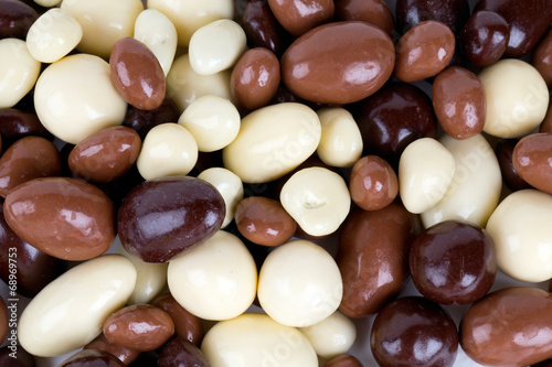 chocolate covered nuts and raisins background