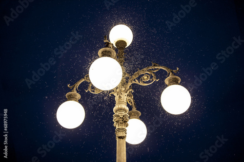 Old street lamp with mosquitoes
