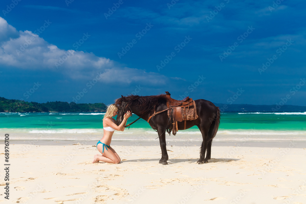 happy girl walking with horse on a tropical beach happy girl walking with horse on a tropical beach