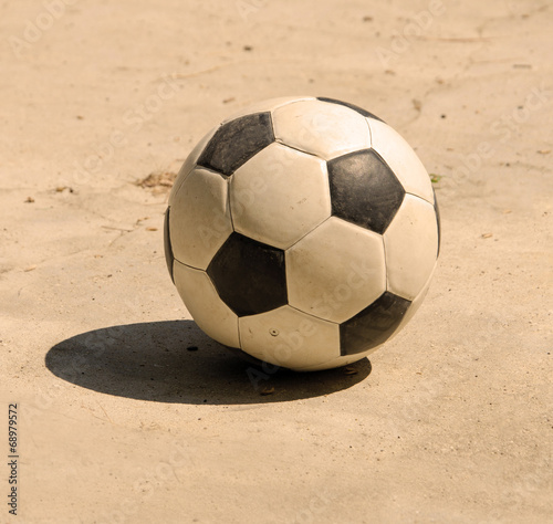 soccer football on cement floor