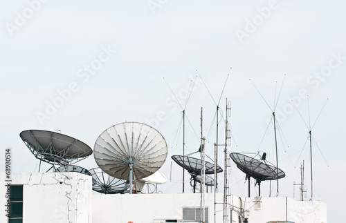 satellite dish and antenna on building