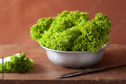 fresh lettuce leaves in bowl