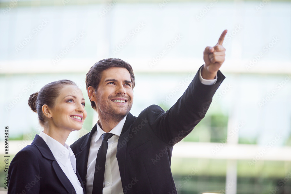 Portrait of business people standing outside. Portrait of business people standing outside.