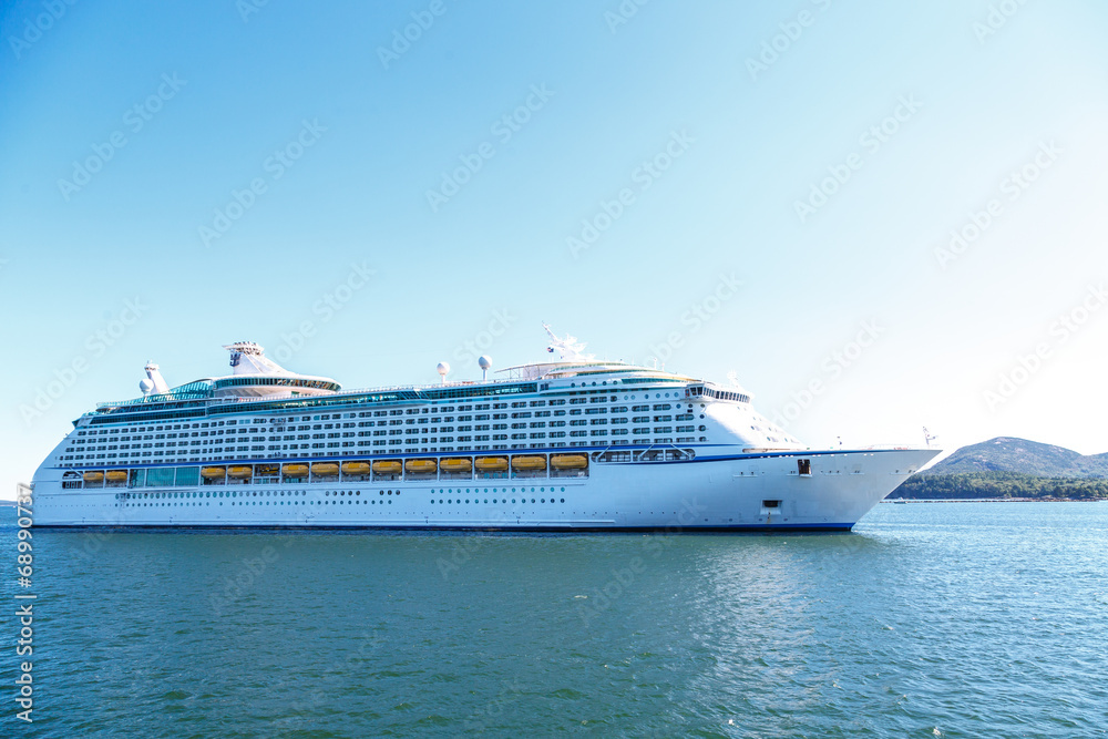 Luxury Cruise Ship on Blue Water and Sky