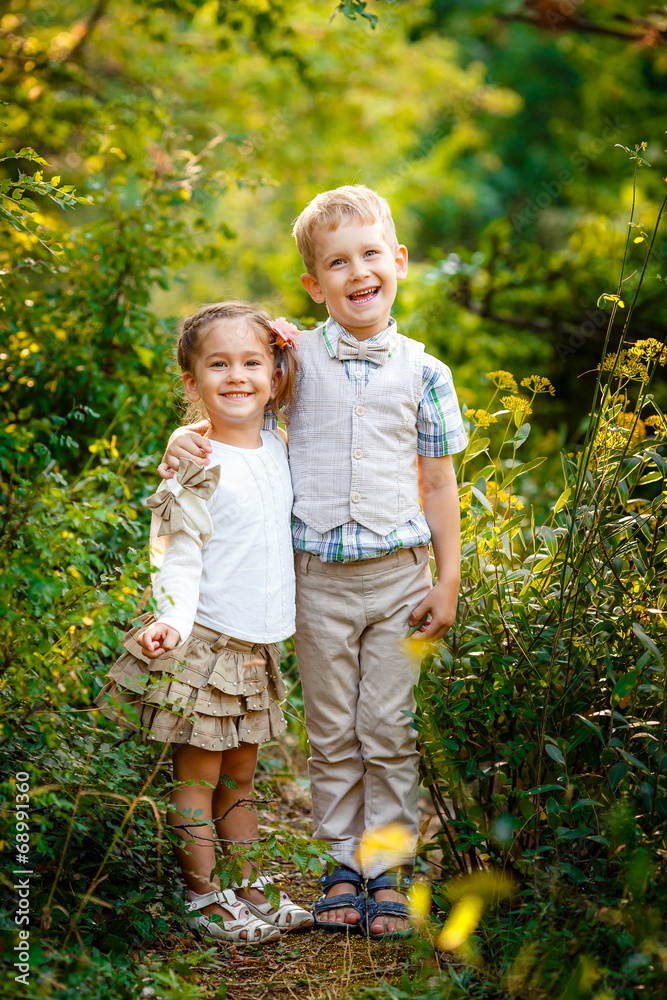 Fototapeta premium Boy with his sister in the park