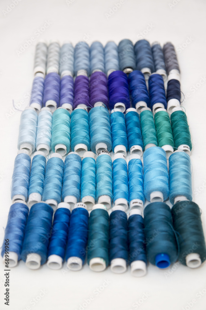 Background of colorful spools of thread Background of colorful spools of thread