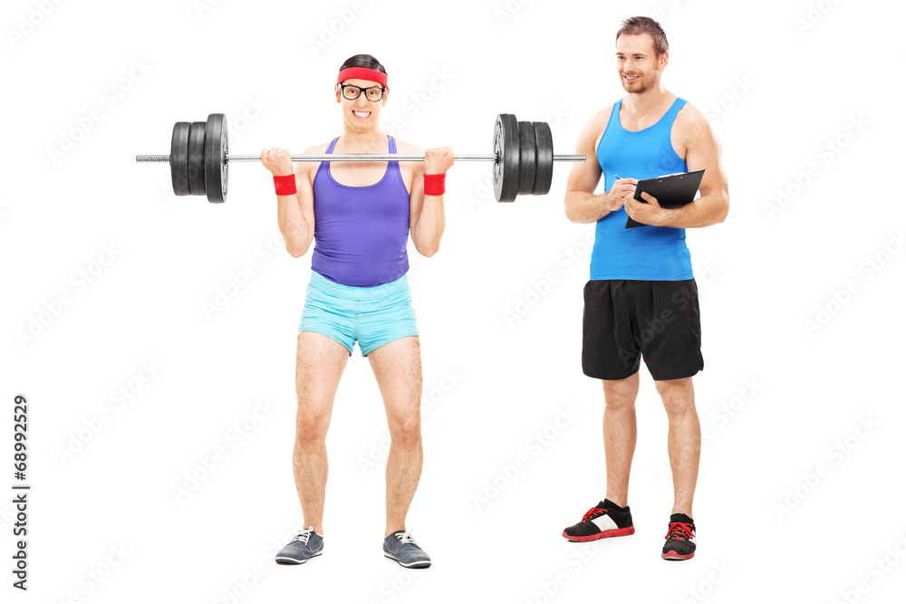 Guy exercising with a fitness trainer Guy exercising with a fitness trainer