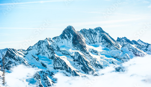 Beautiful snow-capped mountains against the blue sky
