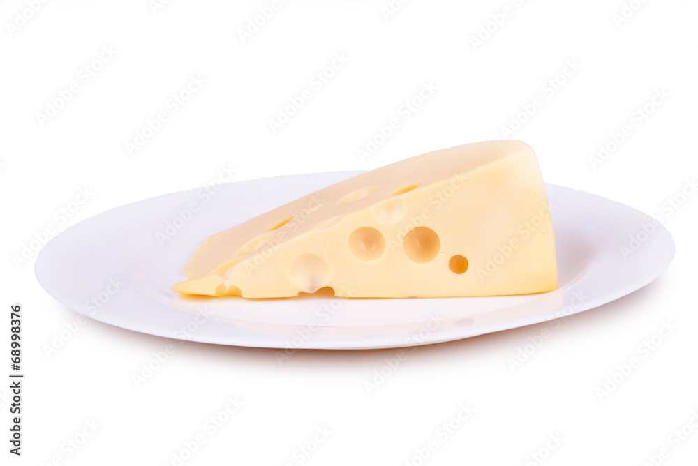 piece of cheese on a white plate