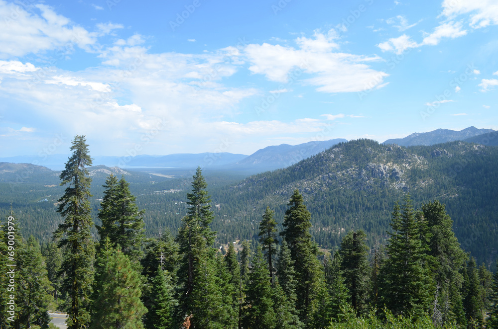 view through pines from Echo summit on Sierra Nevada and Tahoe