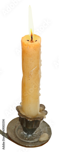 lighted candle close up in candleholder photo