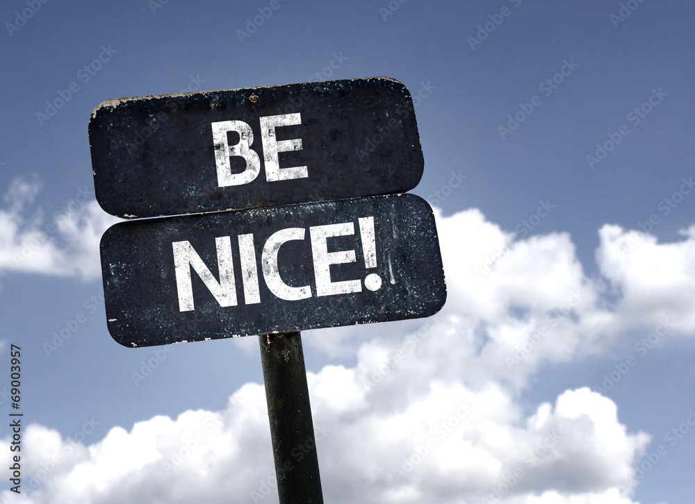 Fotografia Be Nice sign with clouds and sky background