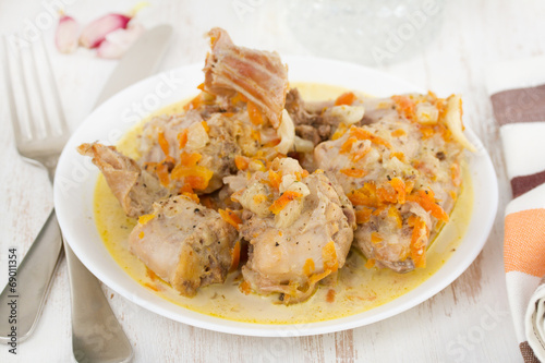 boiled rabbit with carrot on plate
