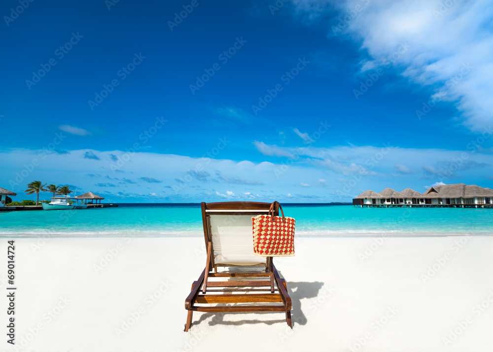 Beach lounger on sand beach Beach lounger on sand beach
