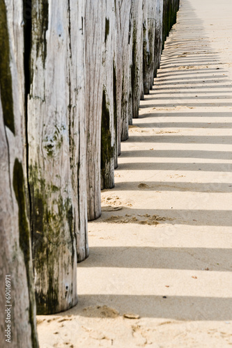 Timber groynes on the beach  at the north sea