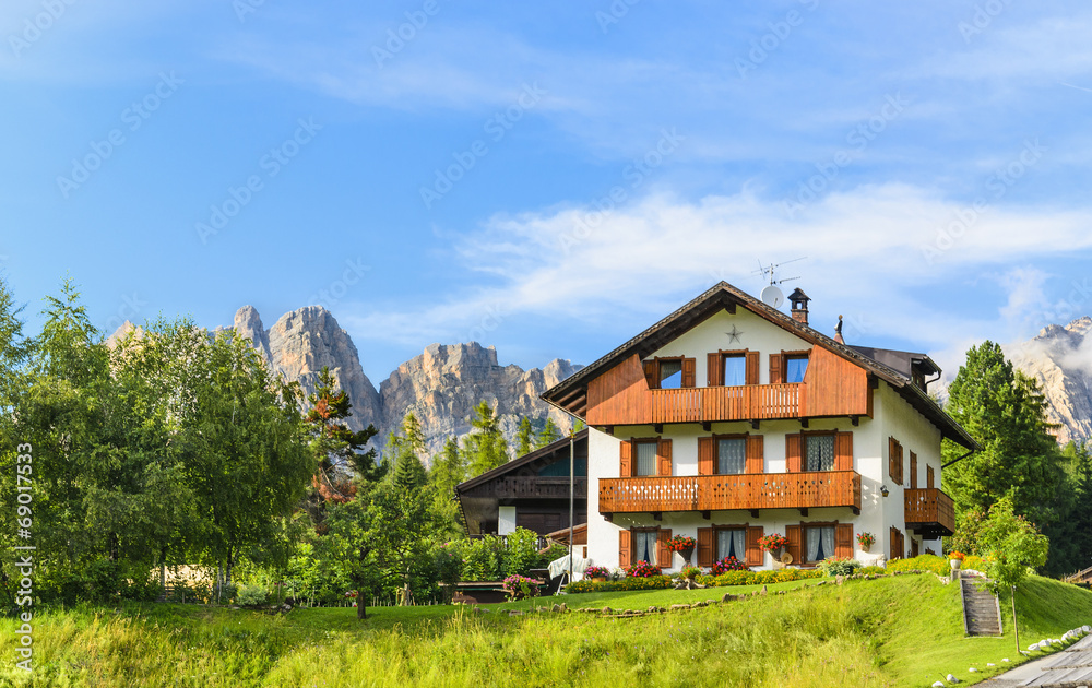 Traditional houses in alpine village on sunny summer day, Italy Traditional houses in alpine village on sunny summer day, Italy