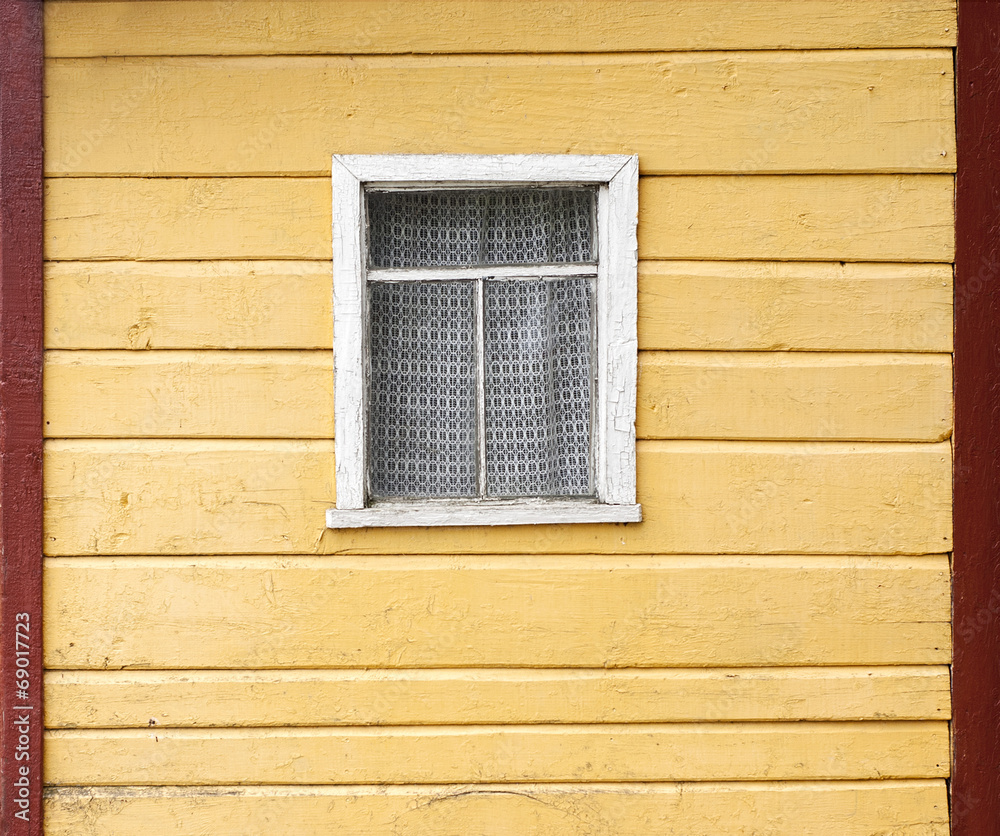 Old wooden wall with a window