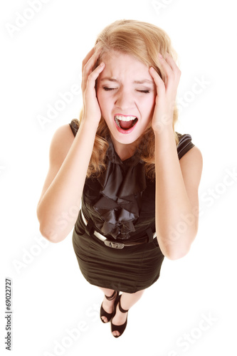 Businesswoman with headache head pain screaming