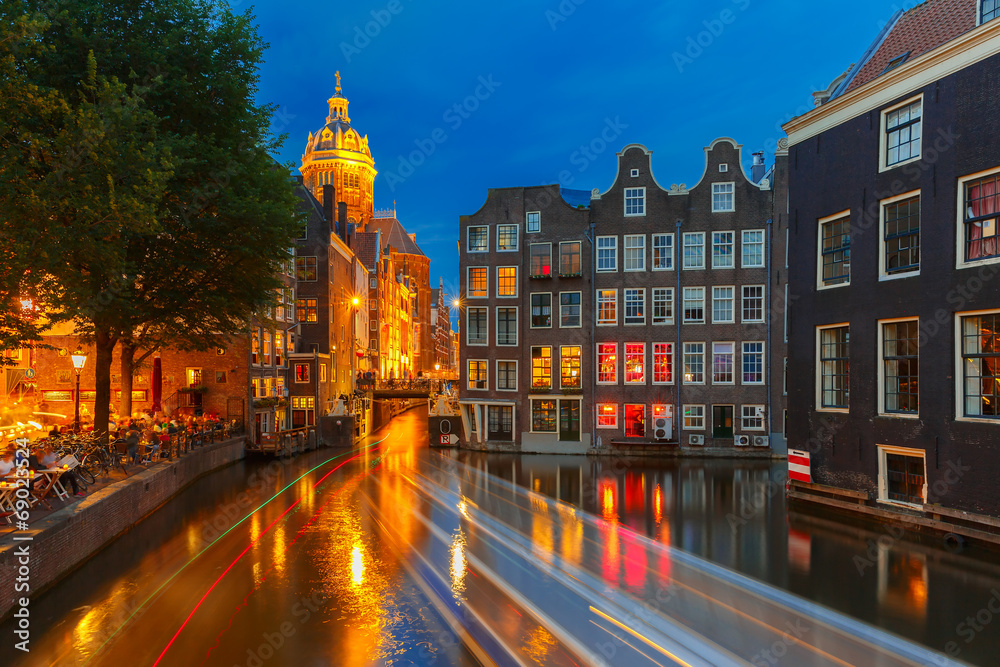 Fototapeta premium Night city view of Amsterdam canal, church and bridge