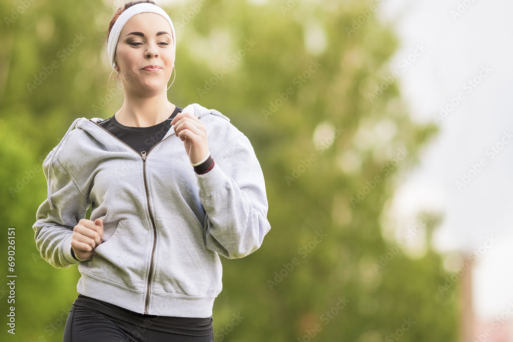 Sport Concept: Young Running Fitness Woman Training Outdoor in t Sport Concept: Young Running Fitness Woman Training Outdoor in t