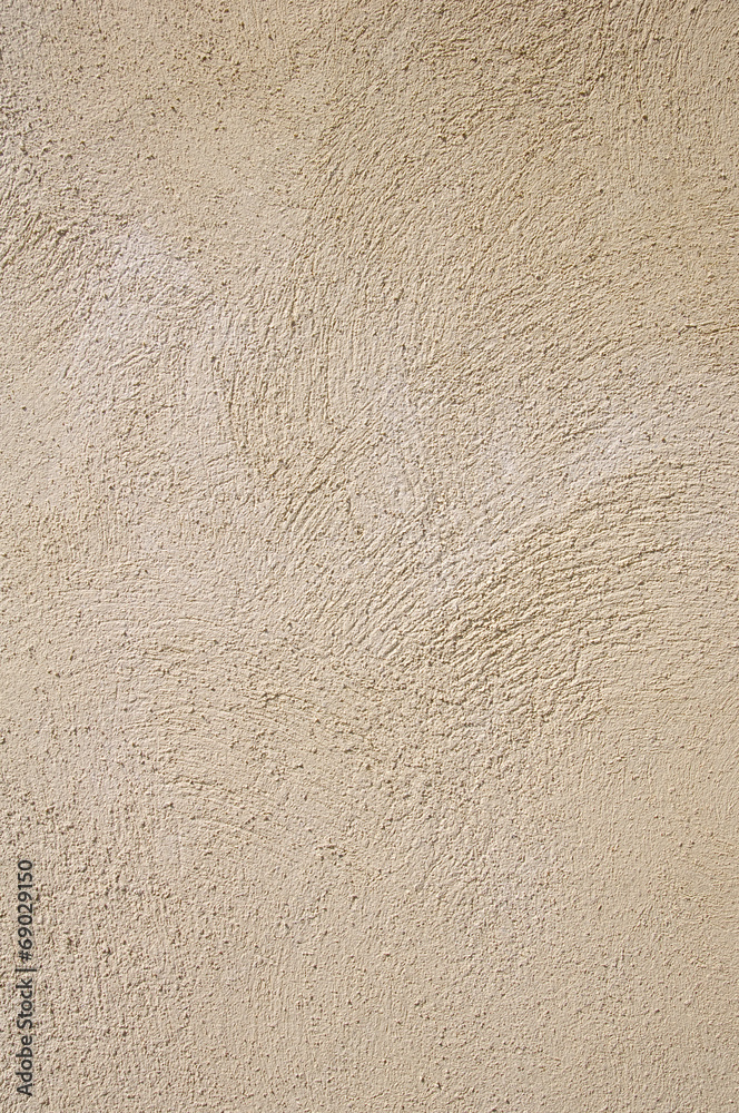 Light yellow rough plaster on wall closeup Light yellow rough plaster on wall closeup