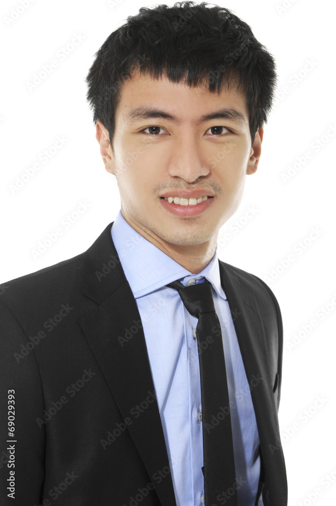 young businessman wearing glasses and smiling. Vertical shot. young businessman wearing glasses and smiling. Vertical shot.