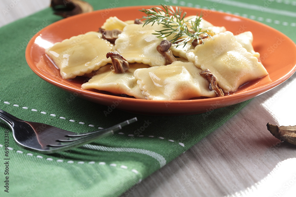 Portion of ravioli with mushrooms and sauerkraut