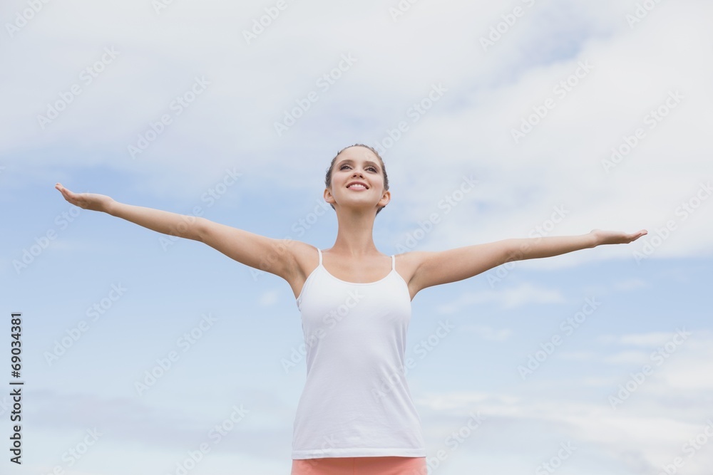 Beautiful woman with arms raised against the sky Beautiful woman with arms raised against the sky
