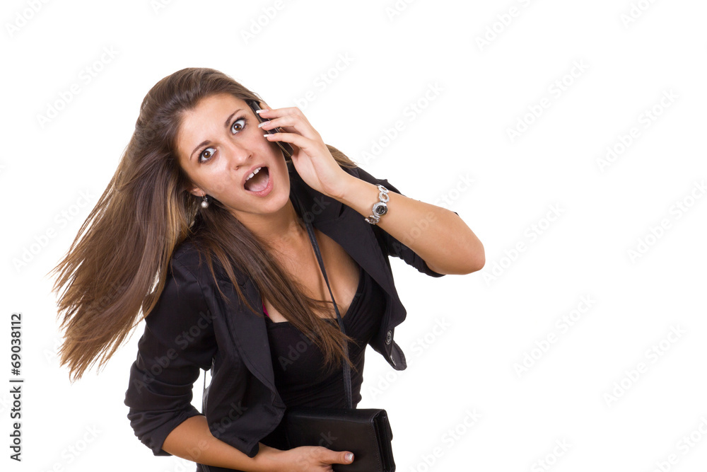 shocked business woman talking on the phone shocked business woman talking on the phone