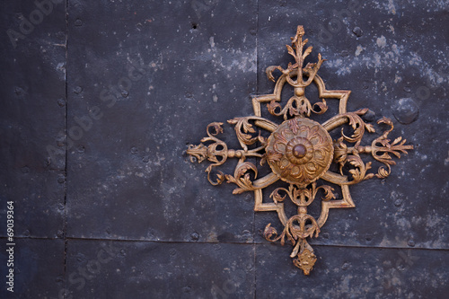 Ancient decorative ornament on metal plate background © 123creative